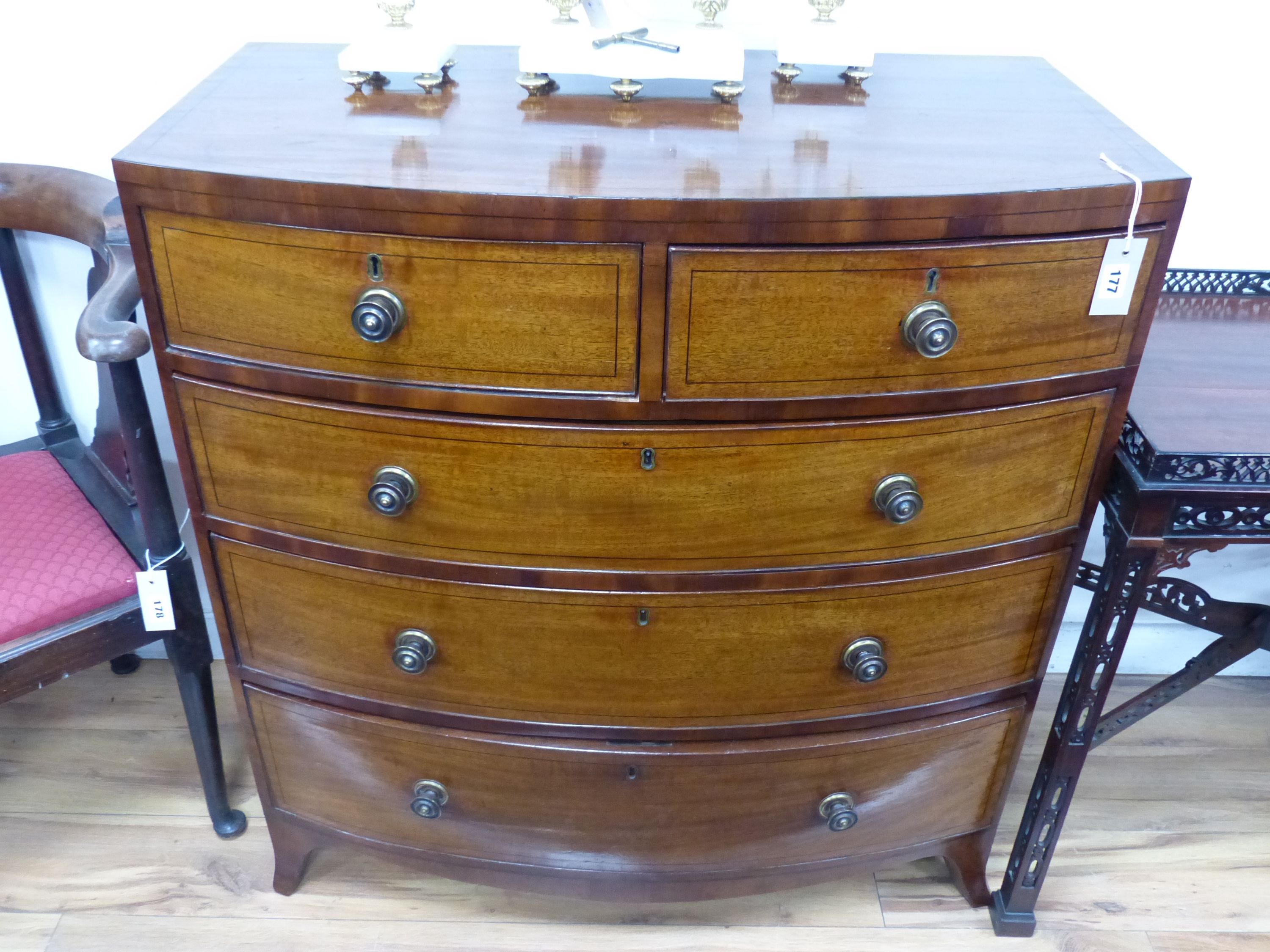 An early 19th century bow fronted mahogany chest, width 91cm, depth 50cm, height 97cm